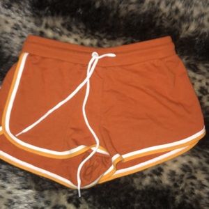 Trendy, orange, athletic shorts